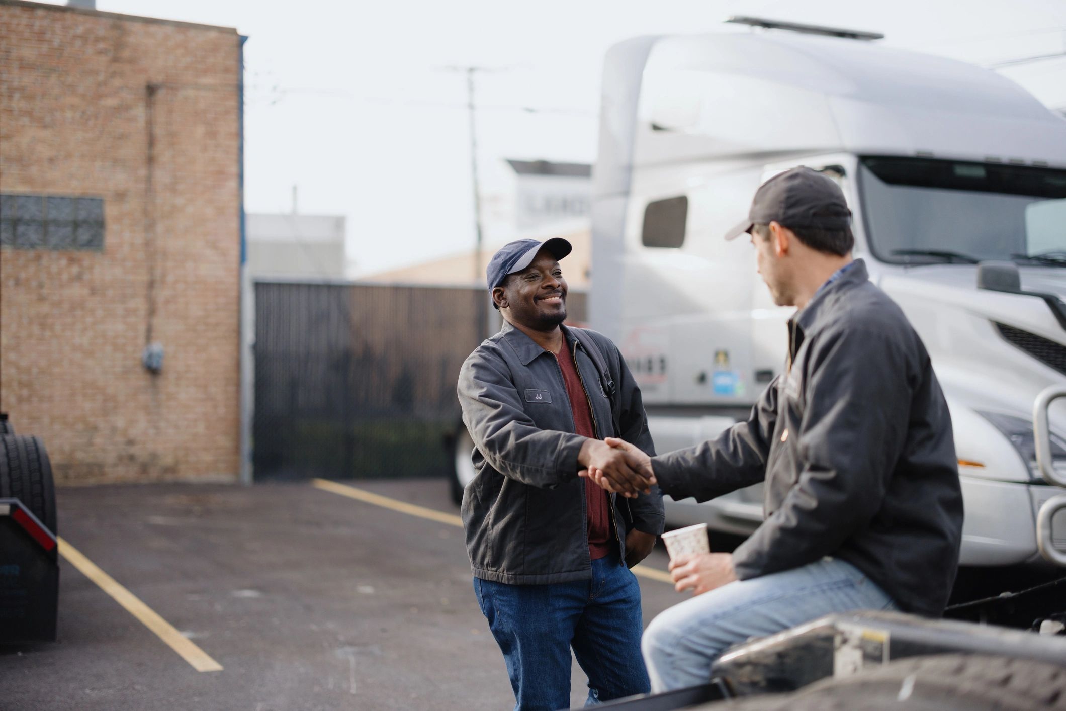 Labor and union advisory discussion ending in a professional handshake